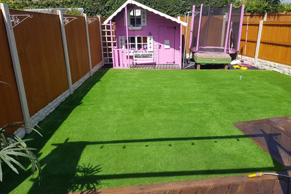 Large rear garden artificial grass in Chester