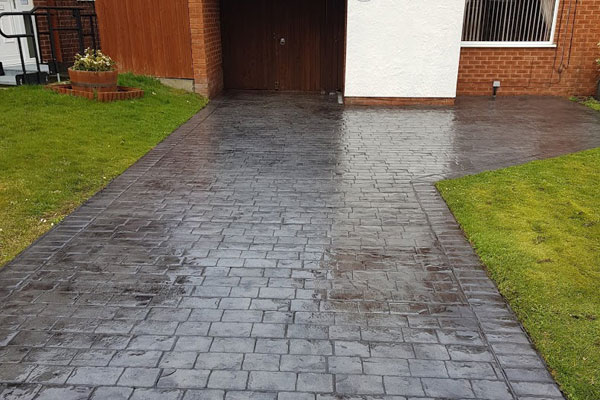 New dark grey concrete driveway