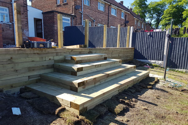 Wooden steps being installed in garden in Chester