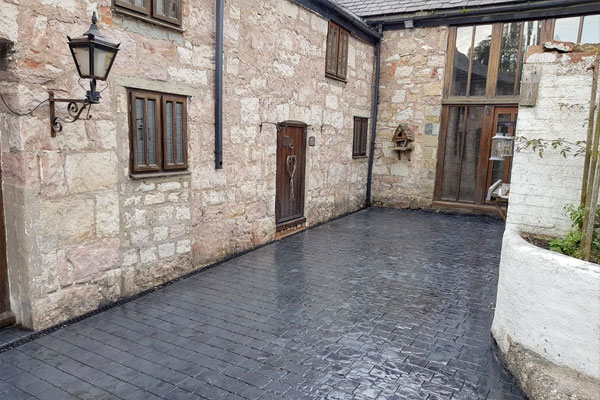 New dark grey concrete driveway at Wrexham house